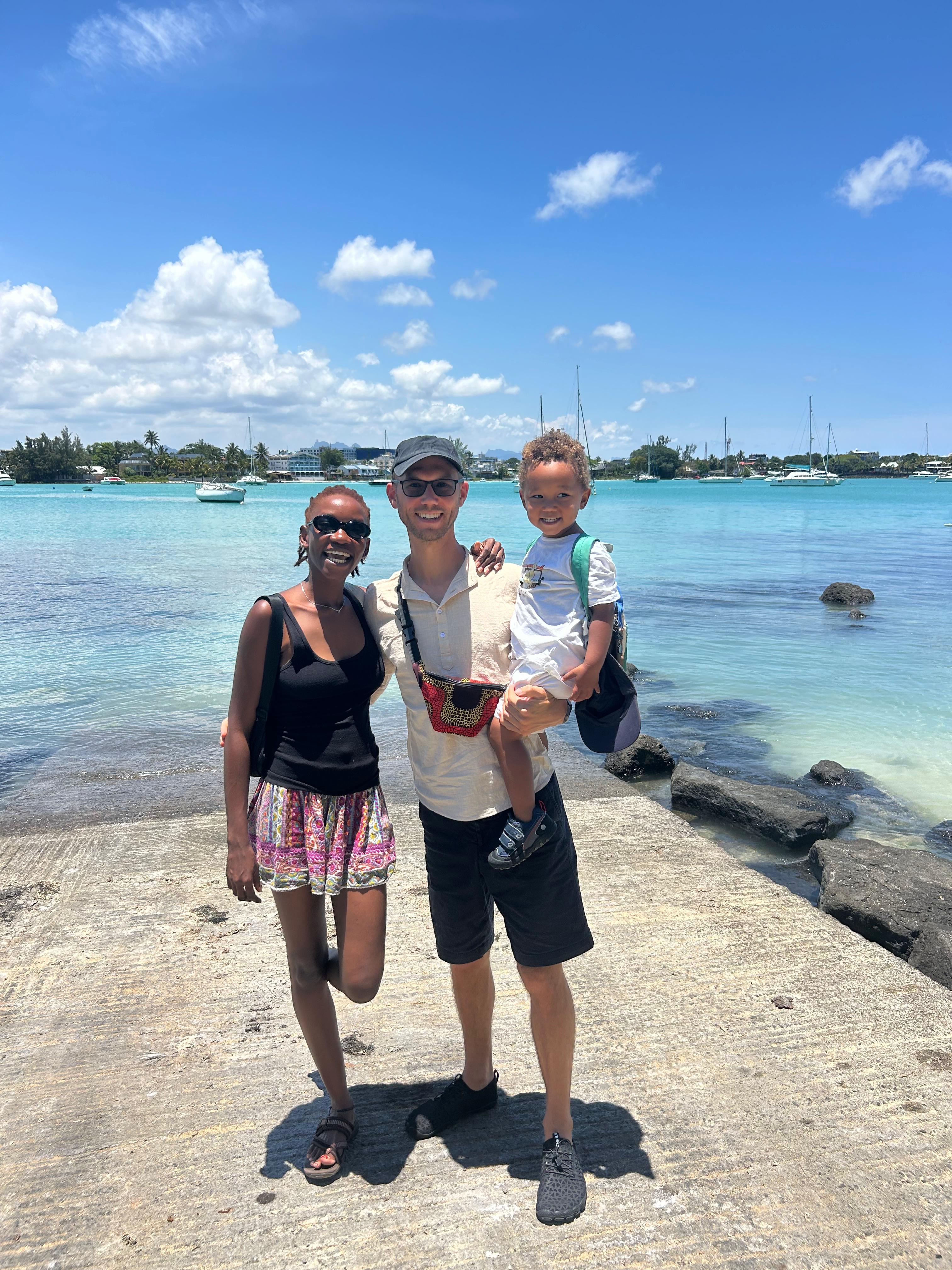 The Freidank Family standing together by the ocean